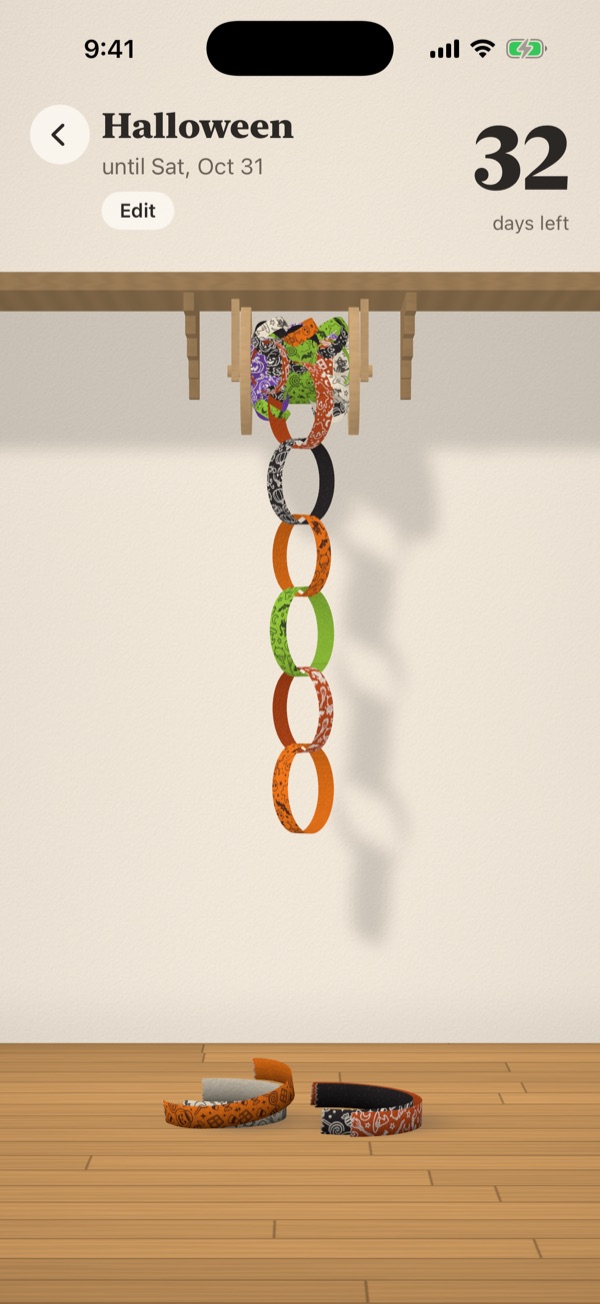 A Halloween chain printed with pumpkins and witch hats, 32 days left until Saturday, October 31